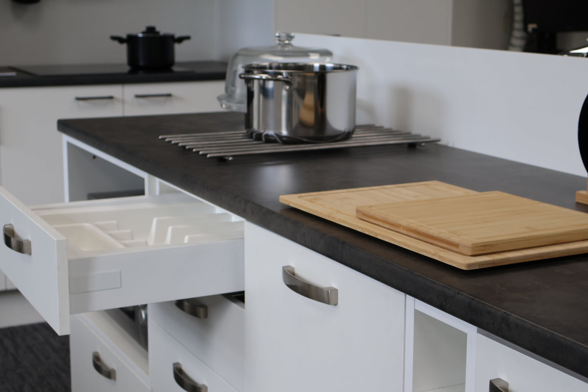 Cabinet drawer open to show cutlery tray organiser